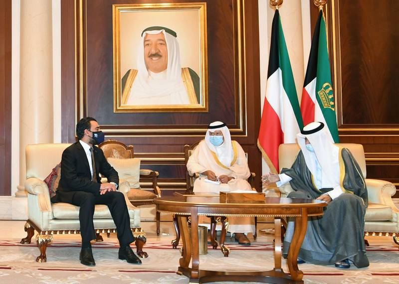 Kuwaiti Emir Sheikh Nawaf Al Sabah receives condolences from Iraqi parliament speaker Mohammed Al Halbousi in Kuwait City. AFP