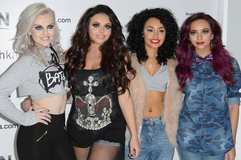 Jesy Nelson, in denim shorts and a crown T-shirt, with her Little Mix bandmates at the Bershka flagship store in London on November 14, 2012