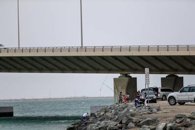 Abu Dhabi, April 13, 2019.  Windy and hazy weather at the Al Hudayriat Bridge area. --   Abu Dhabi residents enjoying the cool weather below the Al Hudayriat Bridge.Victor Besa/The National.Section:  NA Reporter: