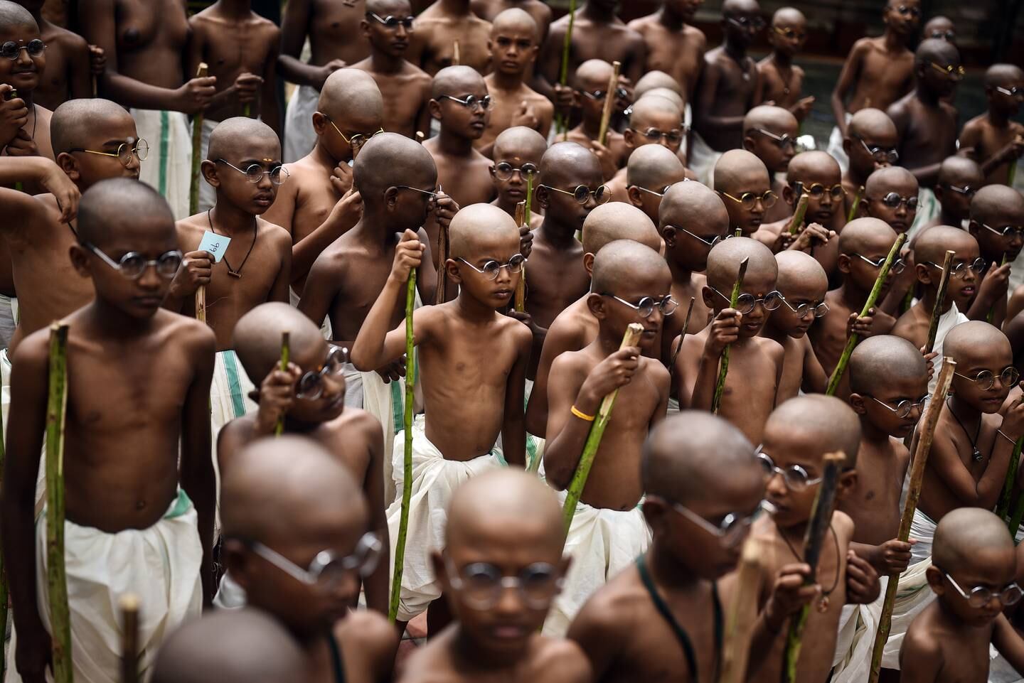 Children dress up as Mahatma Gandhi at Egmore Museum in Chennai, India, on Saturday. EPA