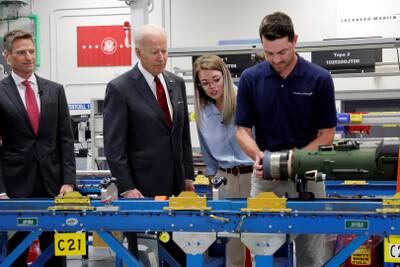 US President Joe Biden and Lockheed Martin chief executive Jim Taiclet with Javelin anti-tank missile assembly workers during a tour of a Lockheed Martin weapons factory in Troy, Alabama, US. Reuters