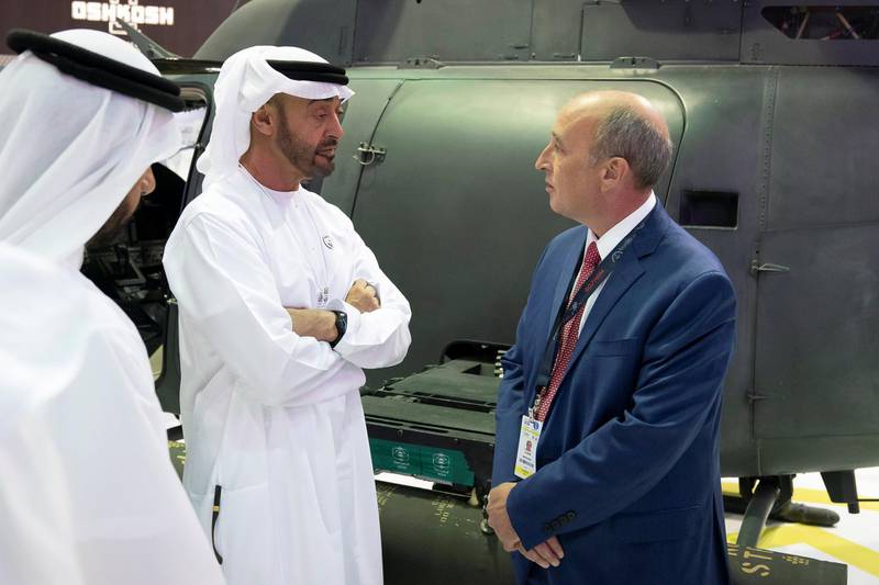 ABU DHABI, UNITED ARAB EMIRATES - February 17, 2019: HH Sheikh Mohamed bin Zayed Al Nahyan, Crown Prince of Abu Dhabi and Deputy Supreme Commander of the UAE Armed Forces (L), speaks with an exhibitor during a tour of the 2019 International Defence Exhibition (IDEX), at Abu Dhabi National Exhibition Centre (ADNEC).

( Ryan Carter / Ministry of Presidential Affairs )
---