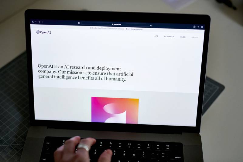 The OpenAI website on a laptop. If asked, ChatGPT can create essays, poems and coding. Bloomberg