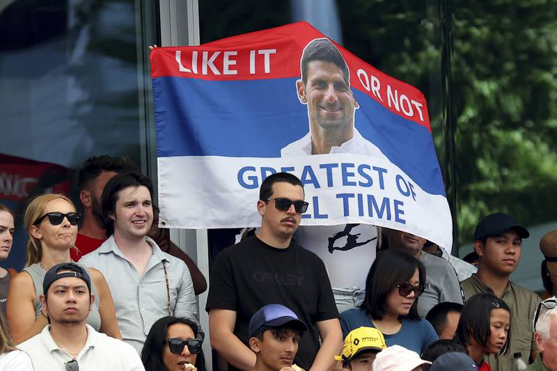 Fans of Novak Djokovic hold a sign during the doubles match at the Adelaide International Tennis tournament. AP Photo