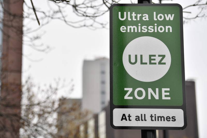 Signs for the ultra-low emission zone in central London in 2019. AFP