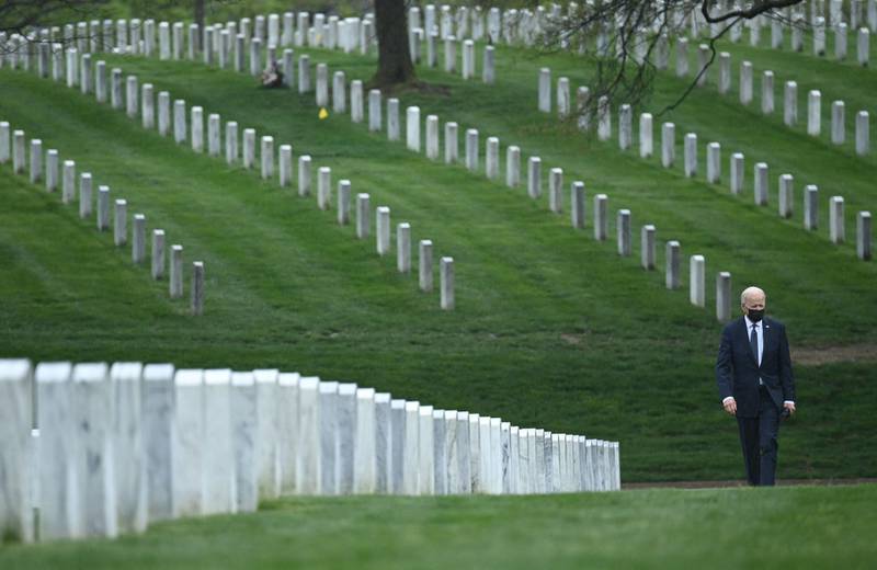 US President Joe Biden walks through Arlington National cemetary to honour fallen veterans of the Afghan conflict in Arlington, Virginia on April 14. AFP