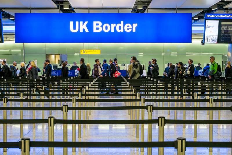 Immigration and passport control at Terminal 2, Heathrow Airport, London. Alamy