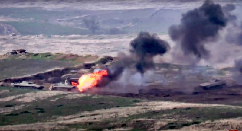 In this image taken from a footage released by Armenian Defense Ministry, Armenian forces destroy Azerbaijani military vehicle at the contact line of the self-proclaimed Republic of Nagorno-Karabakh, Azerbaijan.  AP