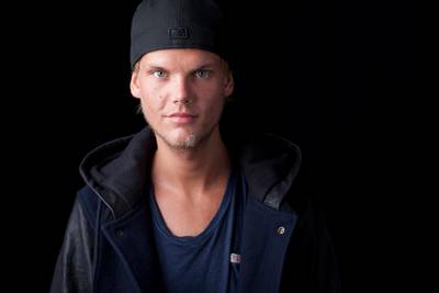 FILE - In this Aug. 30, 2013 file photo, Swedish DJ, remixer and record producer Avicii poses for a portrait, in New York. Avicii first posthumous single will be released next week and a full album will be out in June. Collaborators of the DJ-producer say in a statement Friday, April 5, 2019, that Avicii was close to completing his new album before he died last April. His co-writers continued to work on the nearly finished songs and a new single, â€œSOS,â€ will drop on April 20. (Photo by Amy Sussman/Invision/AP, File)