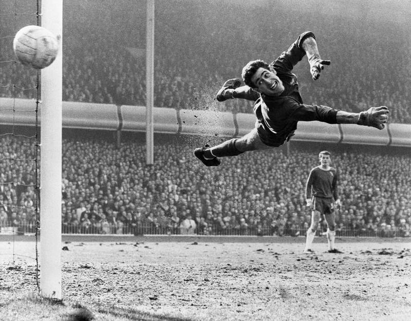 Chelsea goalkeeper Peter Bonetti makes a flying save, watched by teammate Eddie McCreadie.  S&G/PA Images