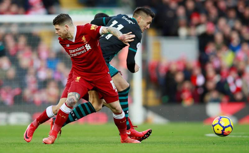 Soccer Football - Premier League - Liverpool vs Southampton - Anfield, Liverpool, Britain - November 18, 2017   Southampton's Dusan Tadic in action with Liverpool's Alberto Moreno    Action Images via Reuters/Jason Cairnduff    EDITORIAL USE ONLY. No use with unauthorized audio, video, data, fixture lists, club/league logos or "live" services. Online in-match use limited to 75 images, no video emulation. No use in betting, games or single club/league/player publications. Please contact your account representative for further details.