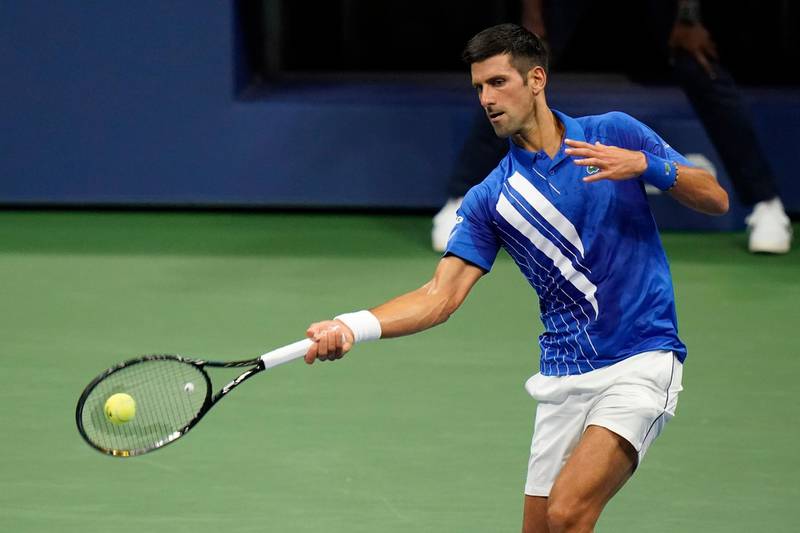 Novak Djokovic, of Serbia, returns to Damir Dzumhur, of Bosnia and Herzegovina, during the first round of the US Open tennis championships, in New York. AP