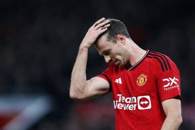 Jonny Evans of Manchester United looks dejected after Erling Haaland of Manchester City scored his team's second goal. Getty