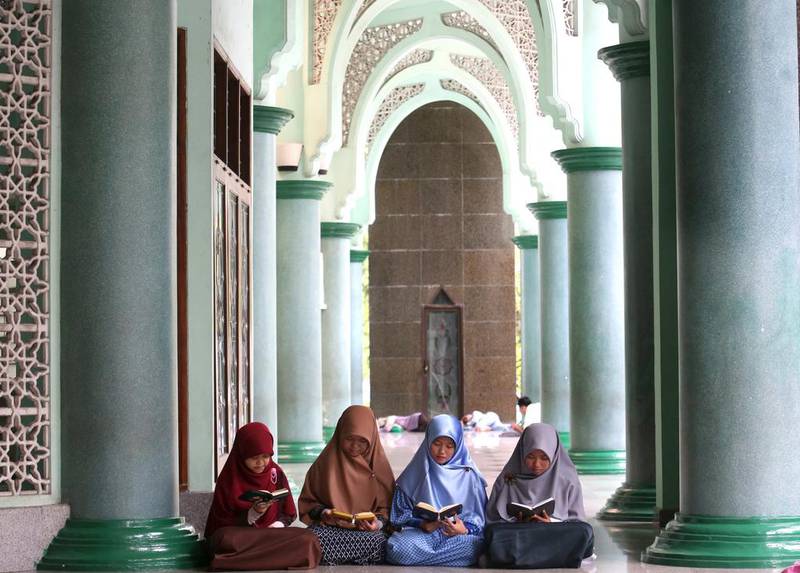 Women read the Quran during the holy month of Ramadan at a mosque on the outskirts of Jakarta, Indonesia. Tatan Syuflana / AP