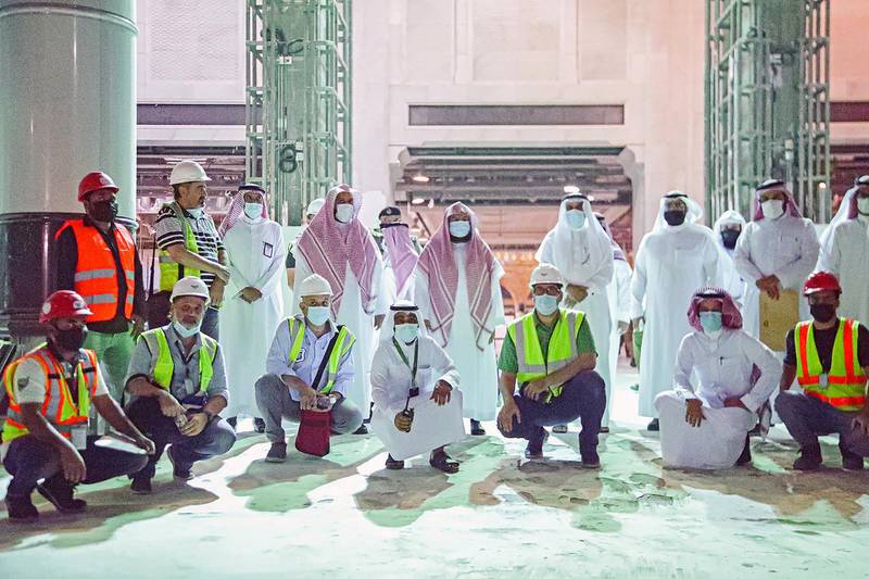 Saudi officials and workers pose for a photo after inspections ahead of Hajj. SPA