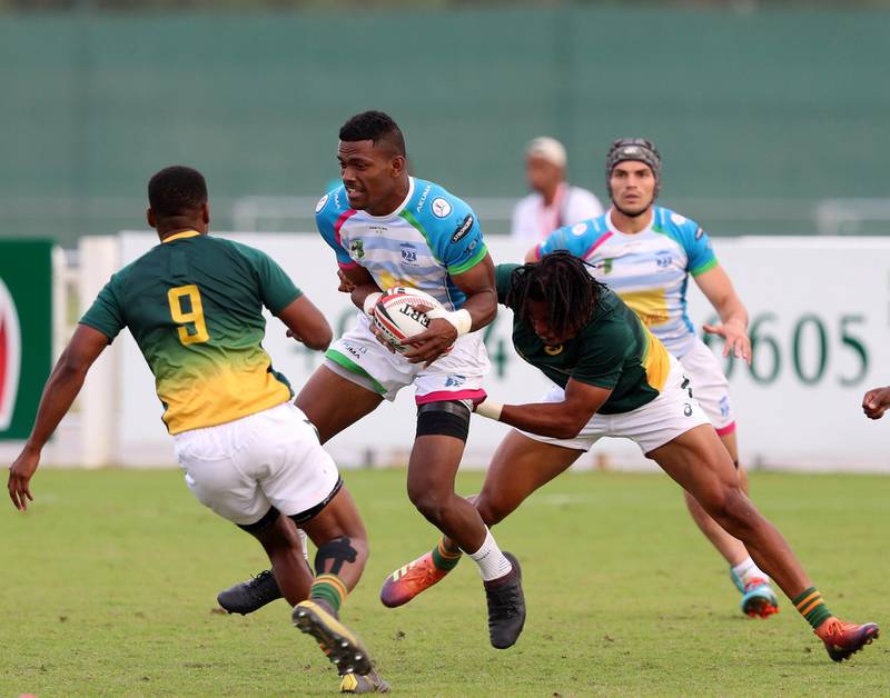 Dubai, United Arab Emirates - December 07, 2019: Jiuta Wainiqolo of Speranza takes on the South Africa defence in the game between South Africa 7s Academy and Speranza 22 in the Int Invitational at the HSBC rugby sevens series 2020. Saturday, December 7th, 2019. The Sevens, Dubai. Chris Whiteoak / The National