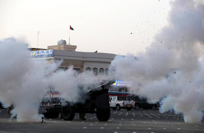 DUBAI, UNITED ARAB EMIRATES , April 24– 2020 :- Dubai Police officers firing the cannon on the first day of Ramadan to break the fast at the Al Mankhool area in Dubai.  (Pawan Singh / The National) For News/Standalone/Online/Instagram. 