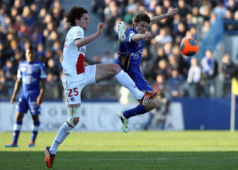 Paris Saint-Germain’s French midfielder Adrien Rabiot, left, vies with Bastia’s French midfielder Yannick Cahuzac during the French L1 football match between Bastia (SCB) and Paris Saint-Germain (PSG) at the Armand Cesari Stadium in Bastia, Corsica, on March 8, 2014. Pascal Pochard-Casabiance / AFP