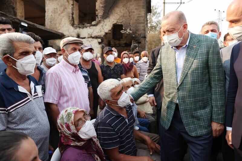 Recep Tayyip Erdogan meets villagers affected by the wildfires in Manavgat. Fires continued in the southern coastal provinces of Adana, Osmaniye, Antalya and Mersin and the western coastal province of Mugla.