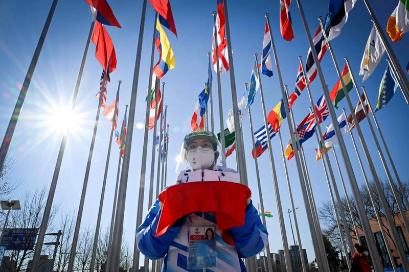 A staff member prepares for the arrival of Thomas Bach before the Olympic Truce Mural ceremony. AFP