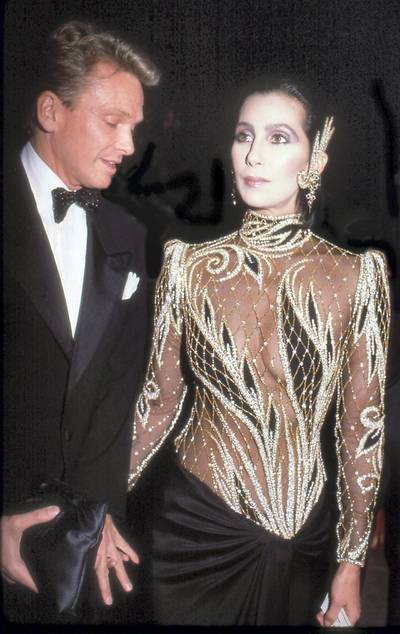 Designer Bob Mackie and the singer and actress Cher attend the Costume Institute Gala at the Metropolitan Museum of Art, New York, New York, 1985. (Photo by Rose Hartman/Getty Images)
