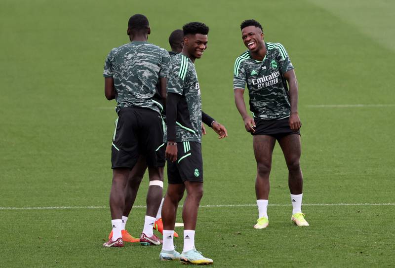 Real Madrid defender Aurelien Tchouameni and forward Vinicius Junior enjoy a joke at training. AFP