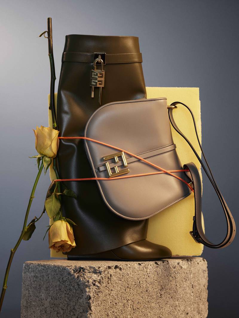 Boots, Dh8,700, Givenchy; bag, Dh10,790, Fendi; flowers, Fine Blooms. Photo: Vaughan Treyvellan at MMG Artists 