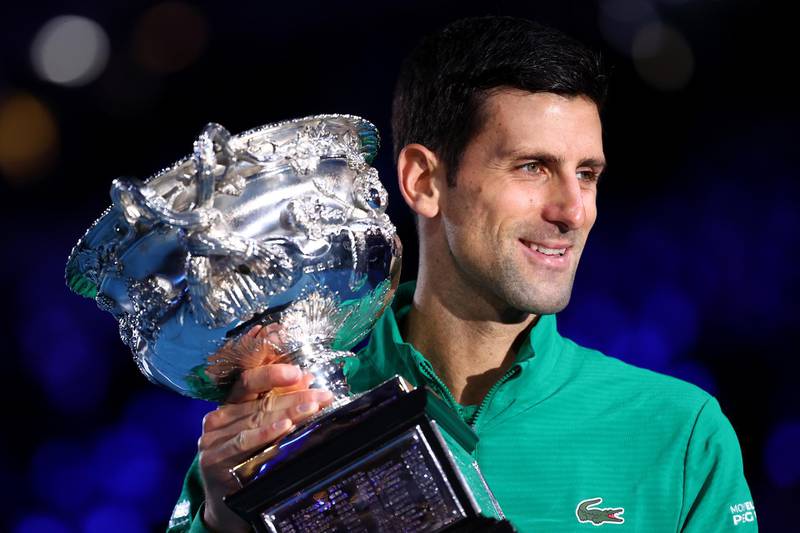 MELBOURNE, AUSTRALIA - FEBRUARY 02: Novak Djokovic of Serbia poses with the Norman Brookes Challenge Cup after winning the Men's Singles Final against Dominic Thiem of Austria on day fourteen of the 2020 Australian Open at Melbourne Park on February 02, 2020 in Melbourne, Australia. (Photo by Cameron Spencer/Getty Images)