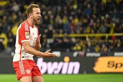 Harry Kane celebrates scoring Bayern's fourth goal in the 4-0 win at Dortmund. AFP
