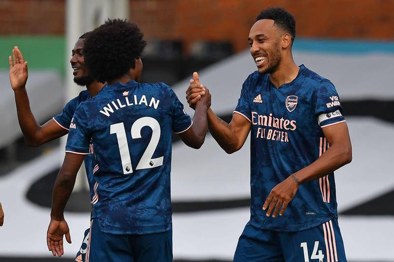 Arsenal's Pierre-Emerick Aubameyang celebrates scoring their third goal with Willian. AFP