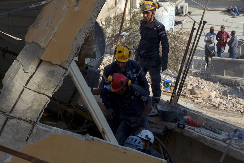 Rescuers used jackhammers to break and remove huge slabs of concrete that made up the roof. Reuters