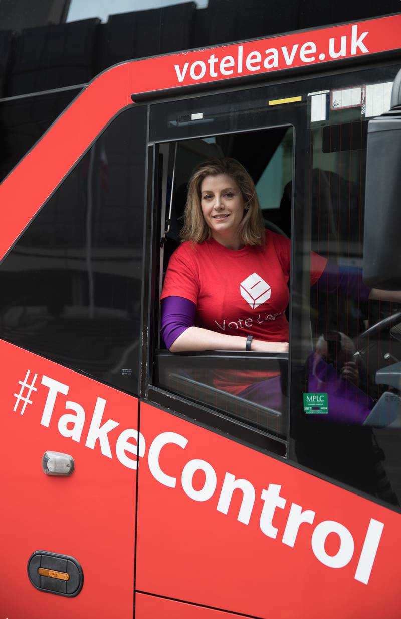 As part of Brexit referendum campaigning, Ms Mordaunt sits behind the wheel of the 'Vote Leave' battle bus as it stops in Portsmouth in May 2016. Getty Images