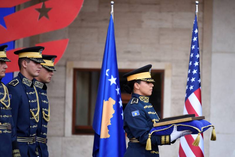 Kosovo's ceremonial guard carry the presidential medal during a presidential medal ceremony for Beau Biden. AFP