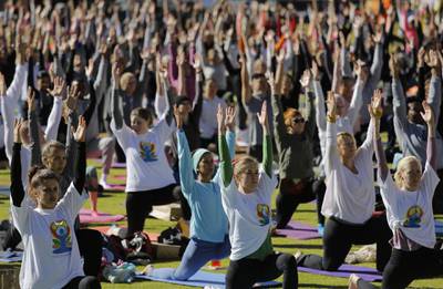 Hundreds of participants practice a group yoga class as part of the annual World Yoga Day celebrations at the Wanderers Stadium, Johannesburg, South Africa.  Kim Ludbrook / EPA