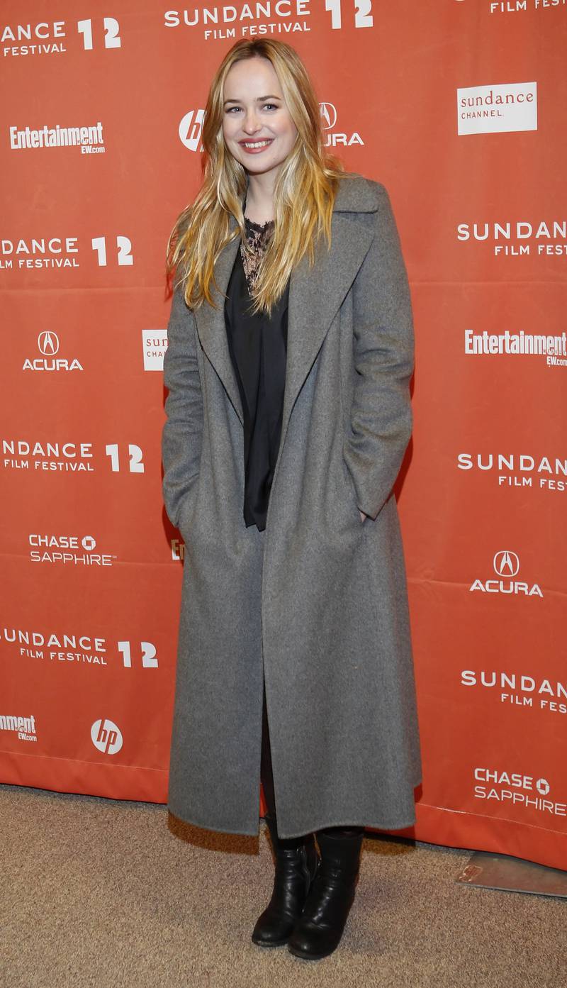 Dakota Johnson, in a grey coat, attends the premiere of 'Goats' at the Sundance Film Festival in Park City, Utah, on January 24, 2012. EPA