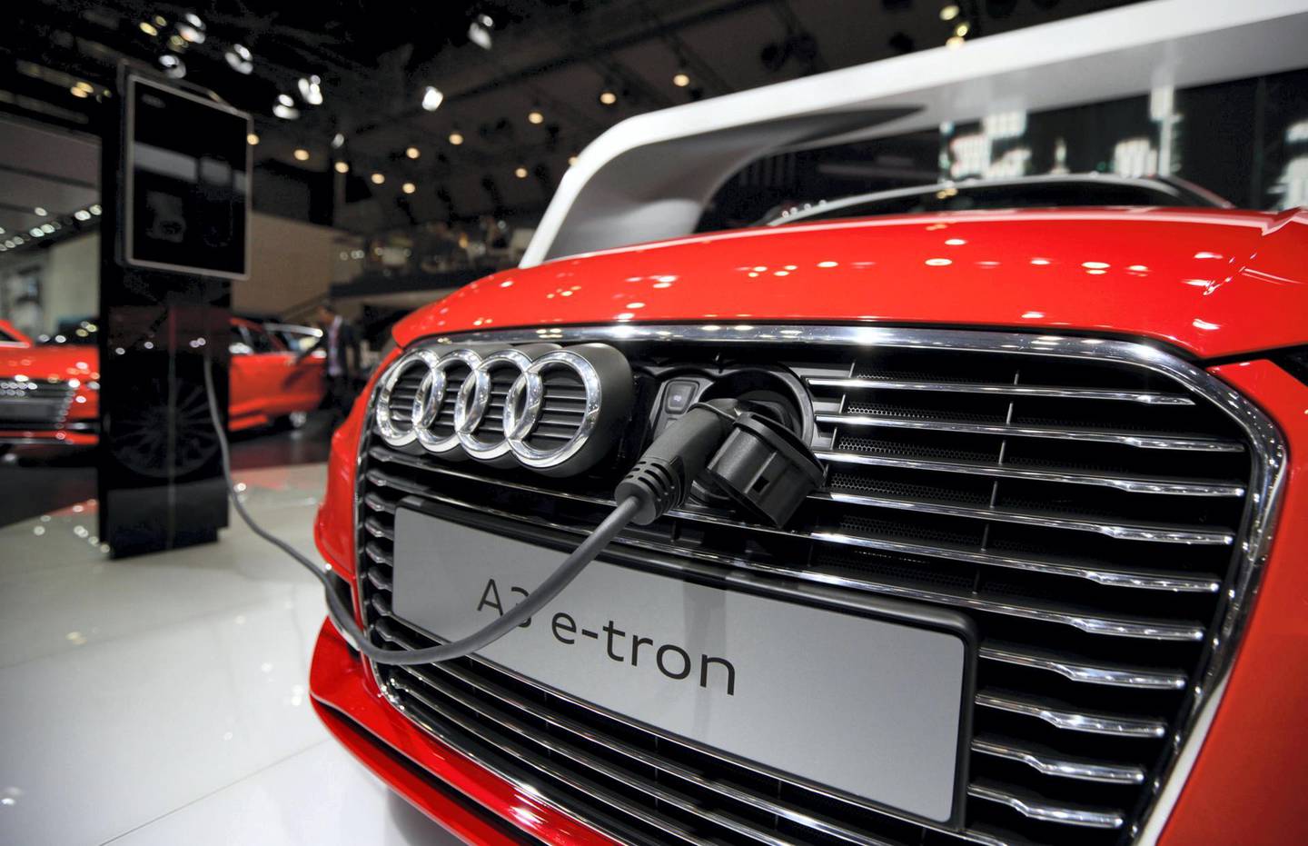 A charging cable is connected to the front grill of an Audi AG A3 e- tron electric vehicle at the 43rd Tokyo Motor Show 2013 in Tokyo, Japan, on Wednesday, Nov. 20, 2013. The autoshow will be open to the public from Nov. 23 to Dec. 1 at the Tokyo International Exhibition Center, also known as the Tokyo Big Sight. Photographer: Tomohiro Ohsumi/Bloomberg