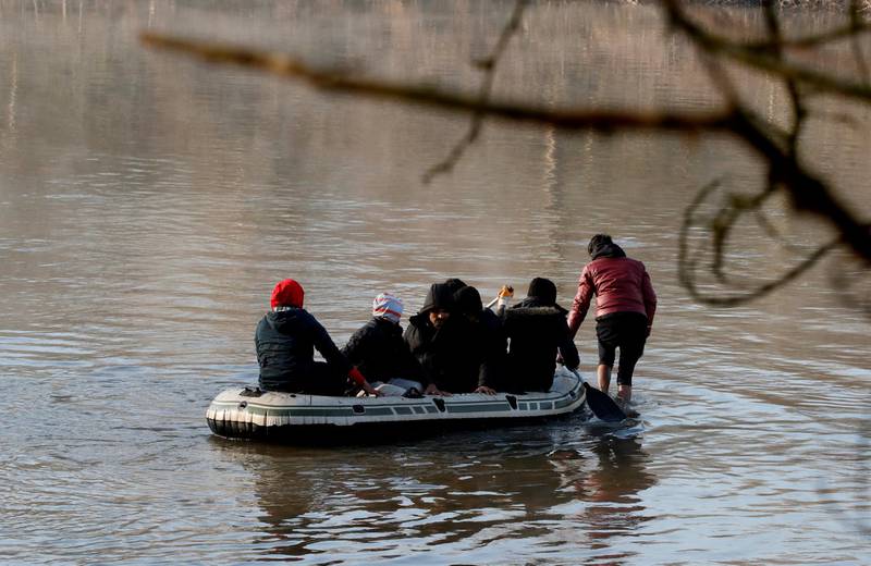 Migrants on a dinghy cross the Evros river to reach Greece, pictured from the Turkish border city of Edirne, Turkey. Reuters