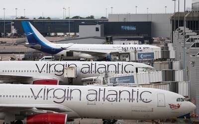 Planes line up at Manchester Airport. EPA