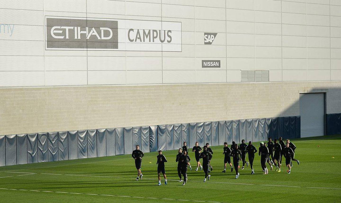 Manchester City players train on Monday at the team’s Etihad Campus in Manchester ahead of a Champions League match on Tuesday. Peter Powell / EPA