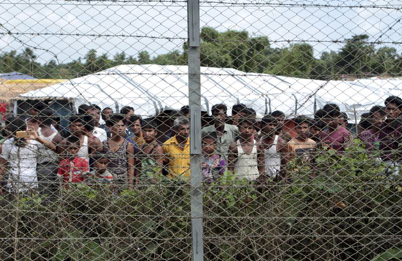 Rohingya refugees wait in the no-man's land between Myanmar and Bangladesh, near Taungpyolatyar village, northern Rakhine state, in 2018.  AP