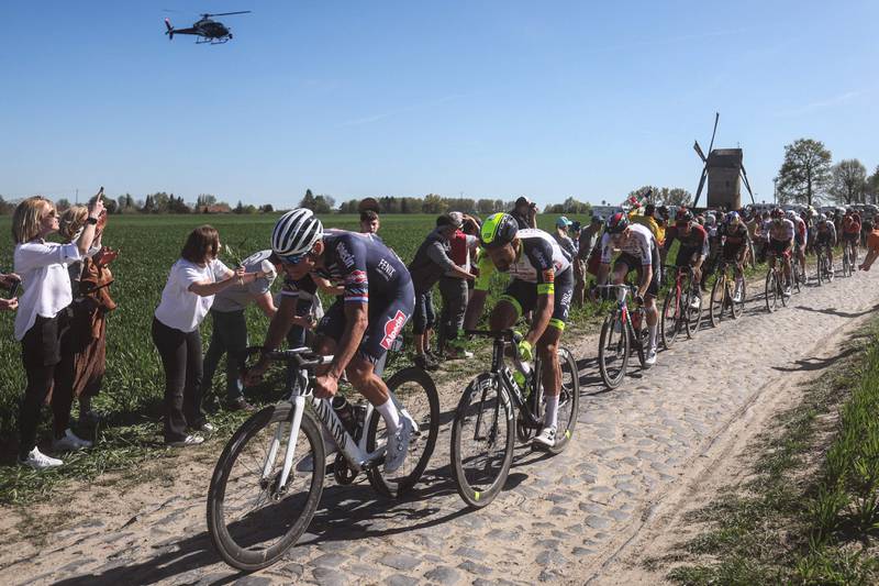 Dutch rider Mathieu Van Der Poel (L)  rides with a breakaway group during the 119th edition of the Paris-Roubaix one-day classic cycling race, between Compiegne and Roubaix, northern France. AFP