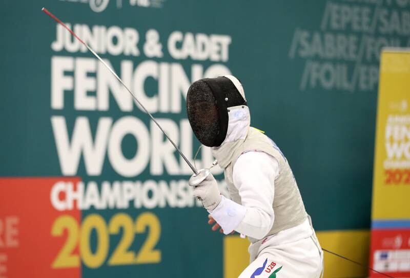 A French competitor in the Junior men's team foil.