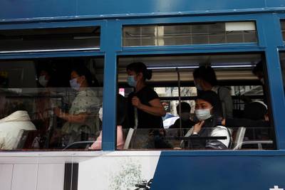 Passengers ride on a tram in Hong Kong. Reuters