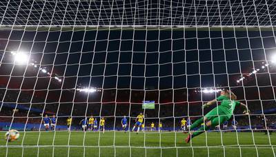 Marta scores from the penalty spot for Brazil against Italy. Getty Images