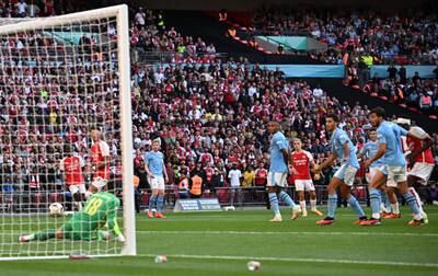 Arsenal's Leandro Trossard scores their equaliser from a deflection. Reuters