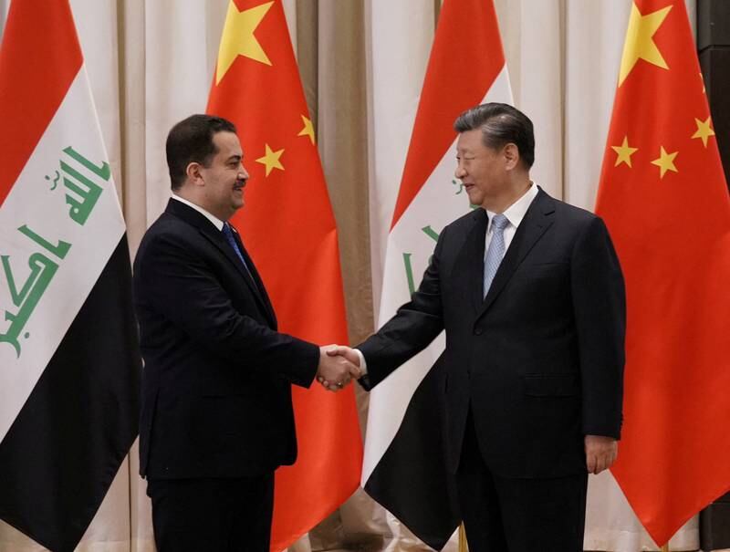 Iraqi Prime Minister Mohammed Shia Al Sudani and Mr Xi.