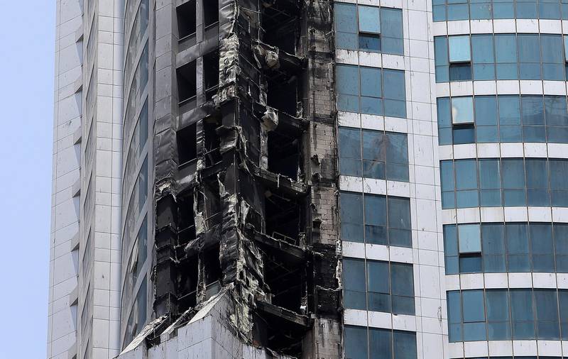 DUBAI , UNITED ARAB EMIRATES , AUG 5 – 2017 :- Damaged portion of the Torch Tower because of fire in the early hours of Friday morning at Dubai Marina in Dubai. ( Pawan Singh / The National ) 