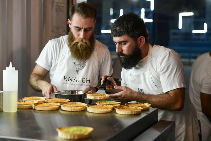 Knafeh, Jerusalem Street Food employees prepare dishes for the festival 