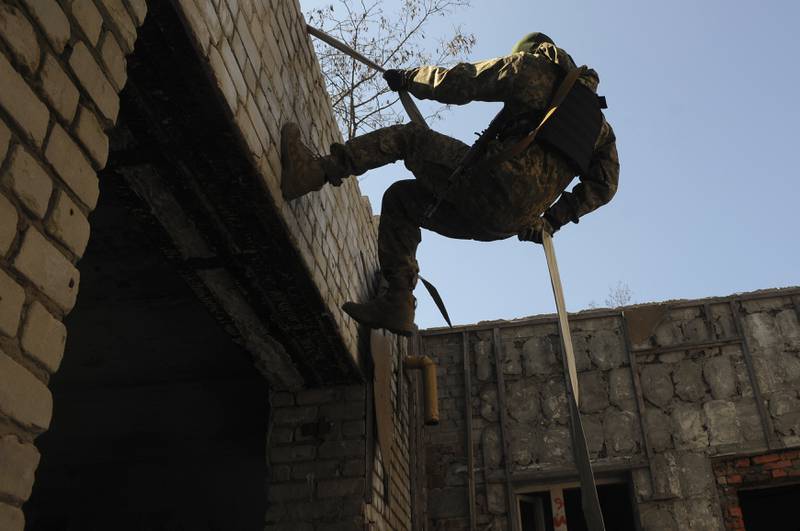 A Ukrainian serviceman attends a training session in Kharkiv outskirts, Ukraine. AP
