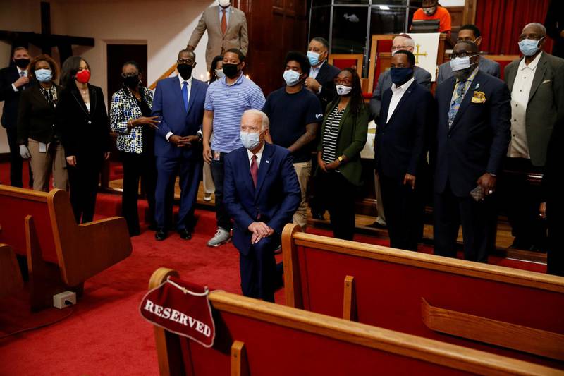 US Democratic presidential candidate and former vice president Joe Biden poses for a picture with pastor of the Bethel AME Church, Rev Dr Silvester S. Beaman and attendees during a visit to the Bethel AME Church in Wilmington, Delaware, US. Reuters